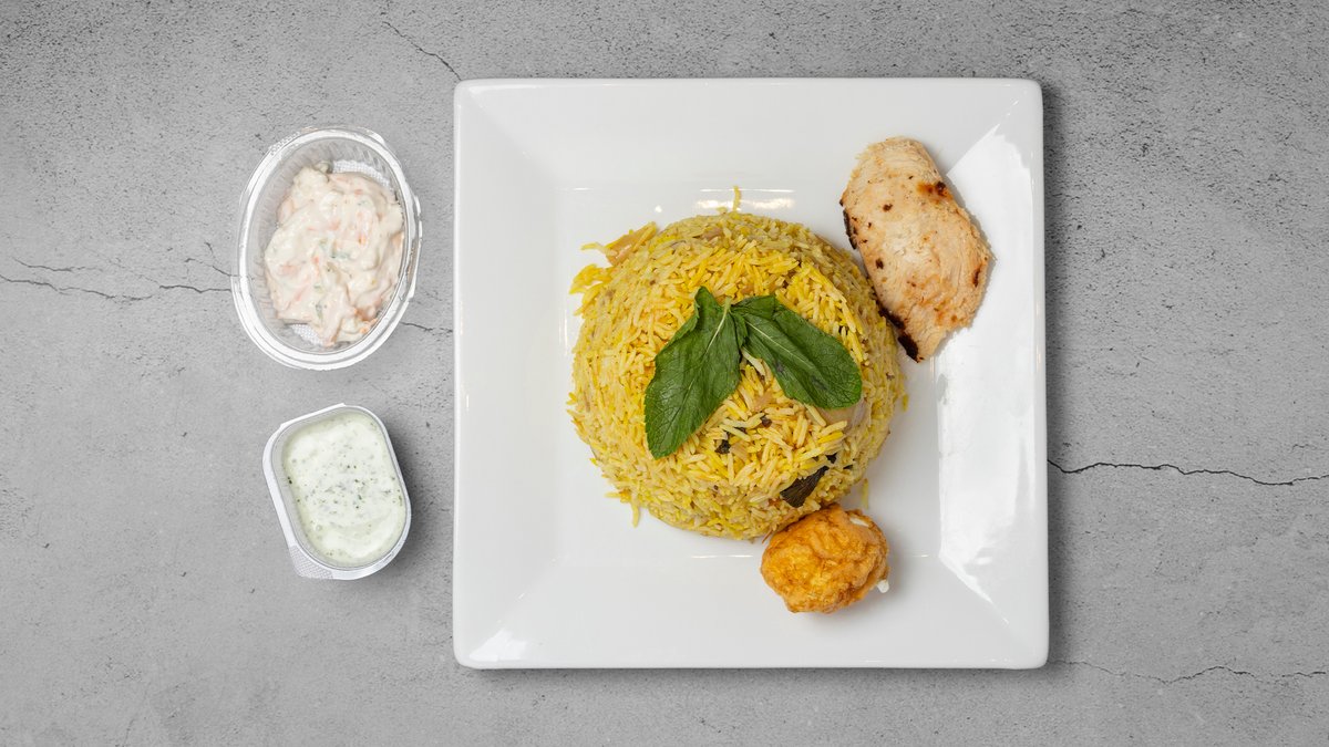 Biryani - Kylling – Aromatisk risret med indiske krydderier, yoghurt og citron -...